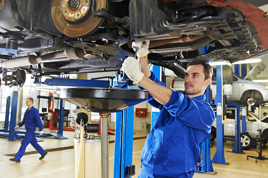 Technician servicing a GMC vehicle at Prothro GMC.