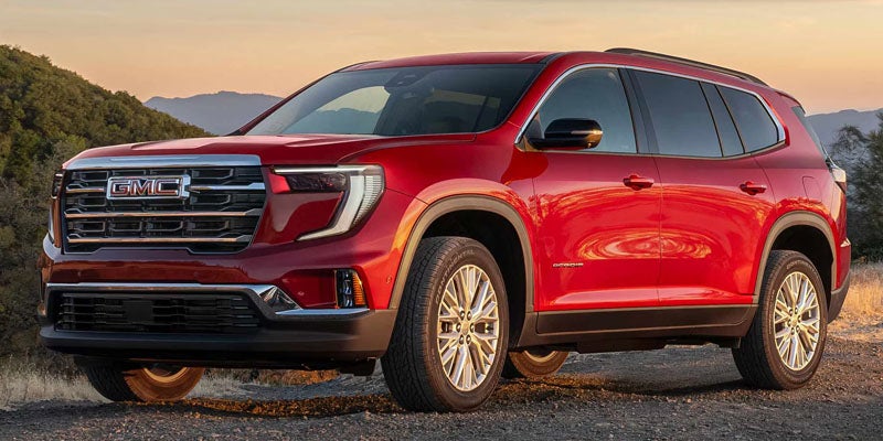 Red 2026 GMC Acadia exterior showcasing available trims