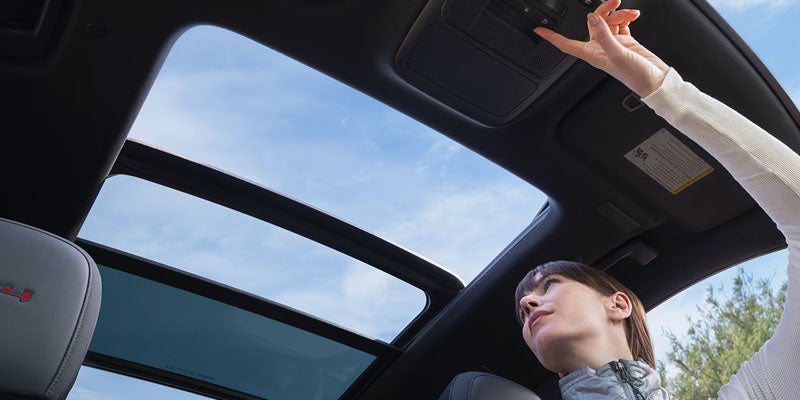 2026 GMC Acadia interior featuring panoramic sunroof.