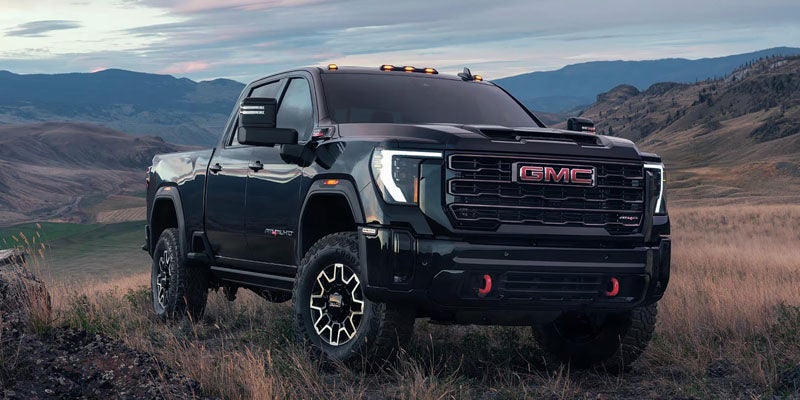 2026 GMC Sierra 2500 HD Pro parked on a scenic mountain road